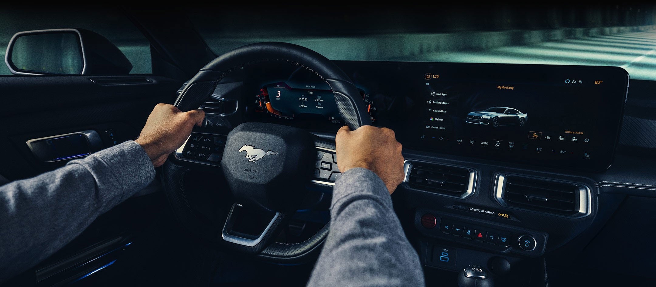 A 2024 Ford Mustang® model interior with a person driving | Harbin Motor Company in Scottsboro AL